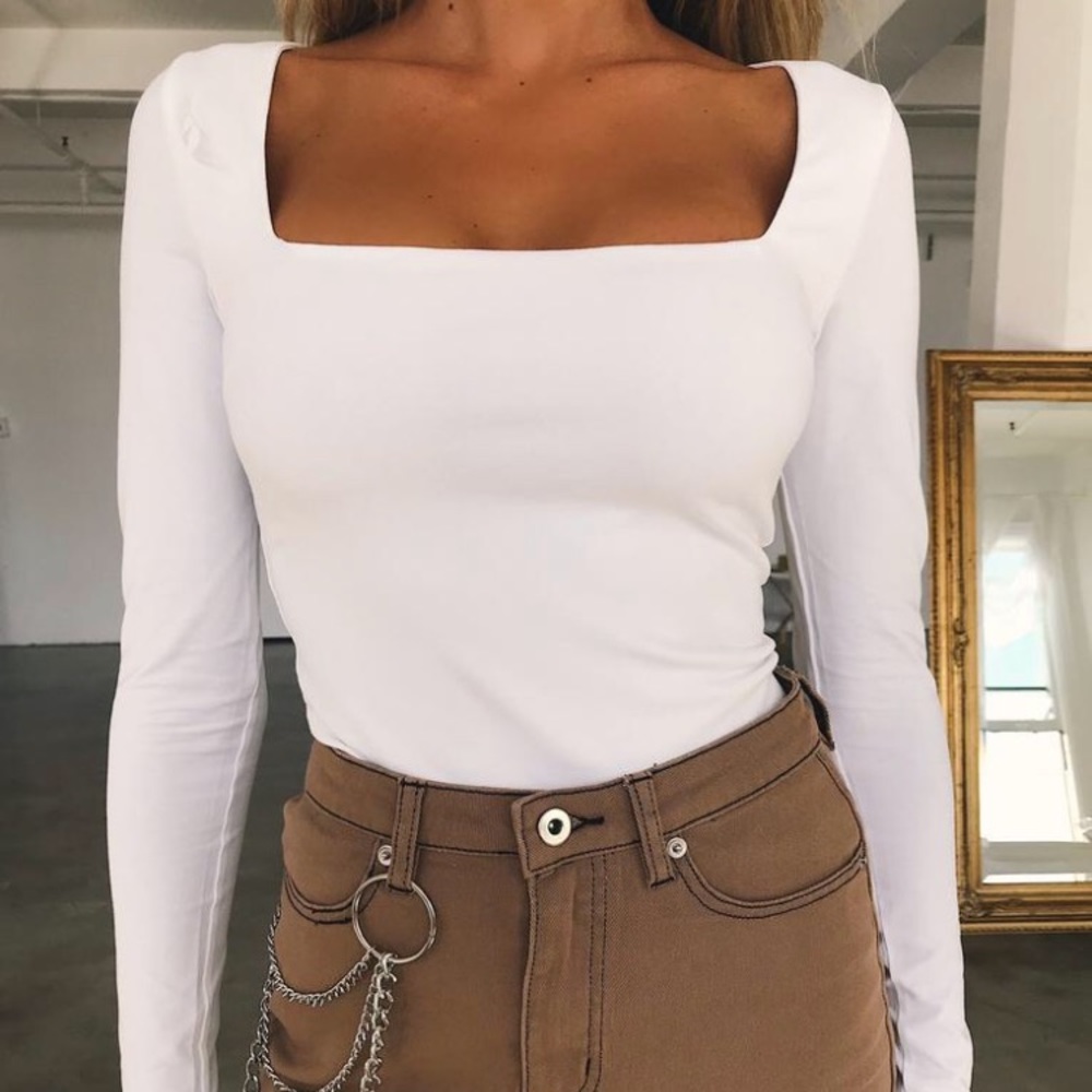 White long sleeve cropped shirt.